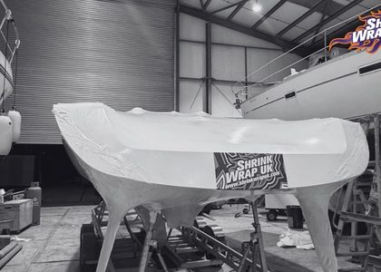 Boat wrapped inside a storage shed