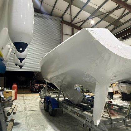 Yachts wrapped for storage inside a shed