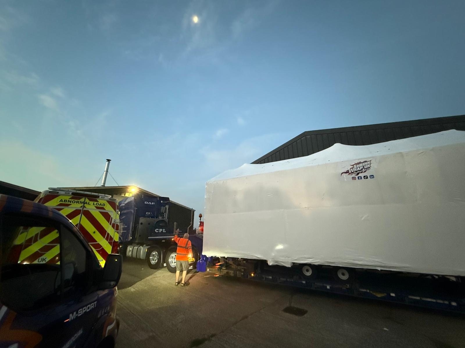 Abnormal load shrink wrapped on a low loader