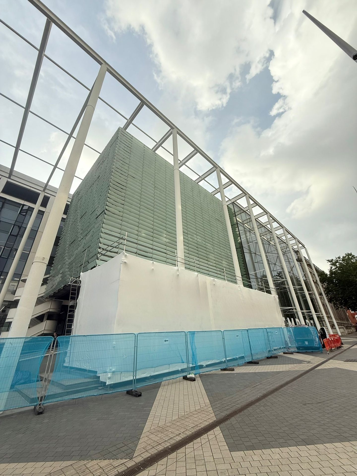 Wrapped enclosure along the base of the Imperial building