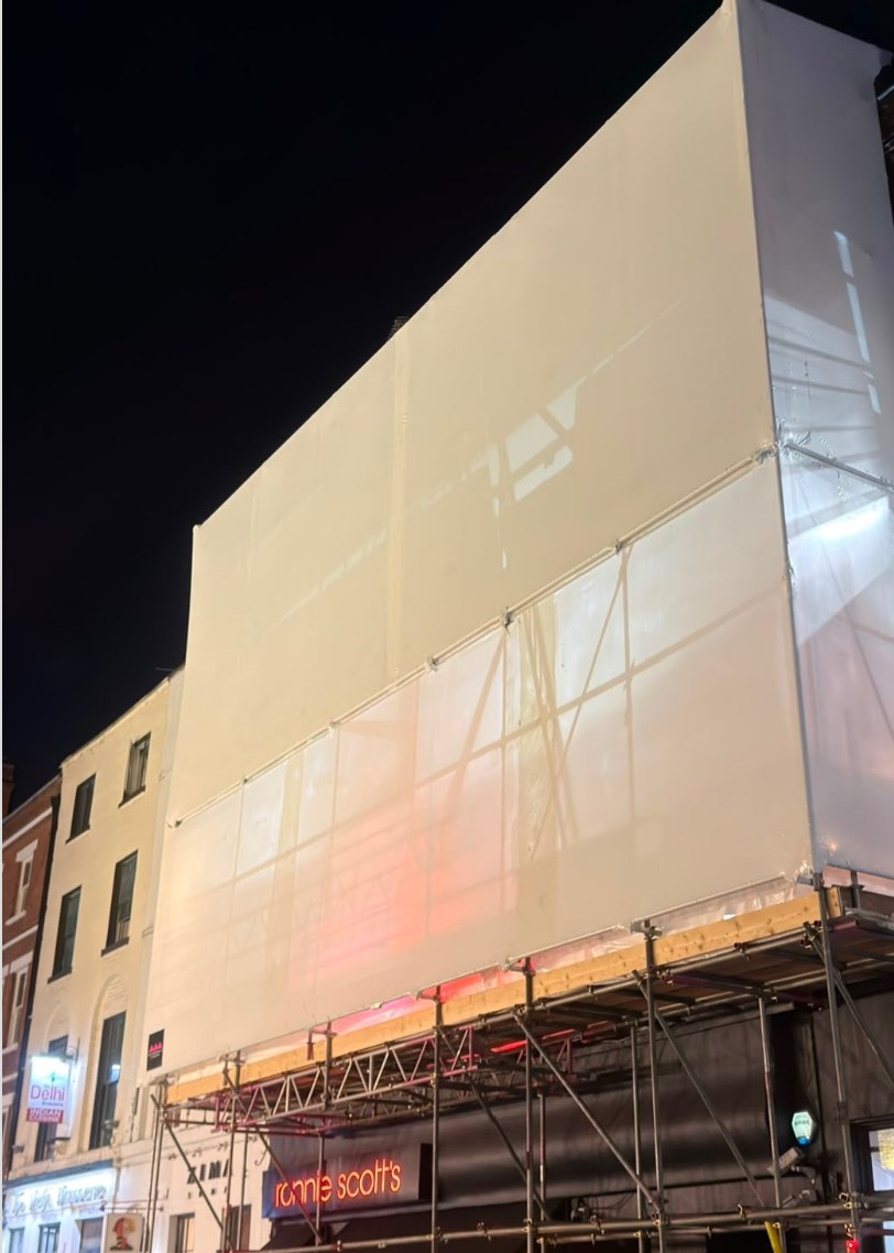 Encapsulation above Ronnie Scott's Jazz Club, Soho, at night