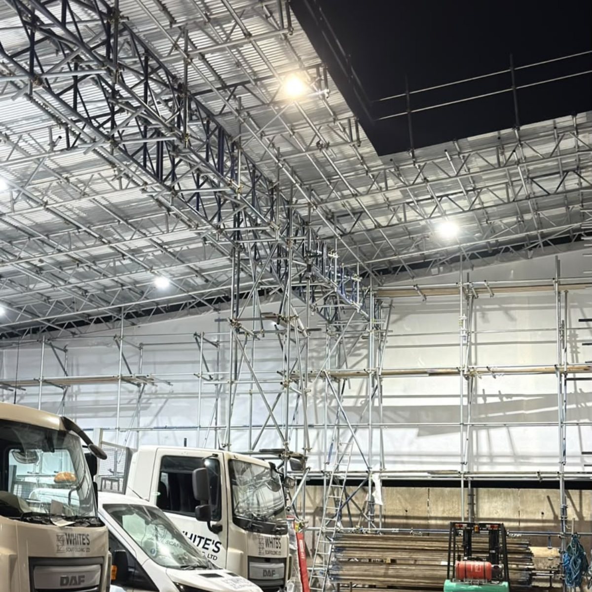 Vehicles working beneath the Salisbury temporary roof
