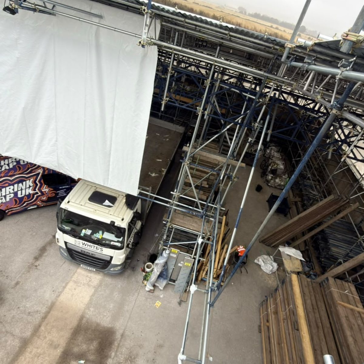 Looking down on a van beneath the wrap
