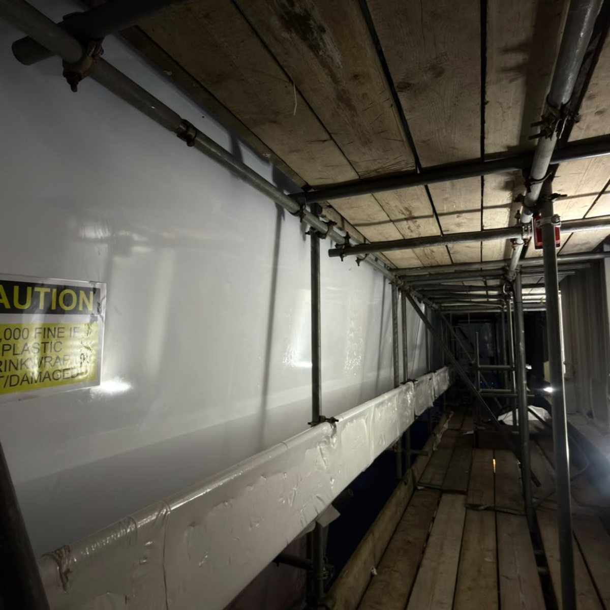 Inside the wrapped scaffold in Tottenham