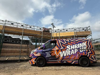 Shrink Wrap UK liveried van on site beside a scaffold