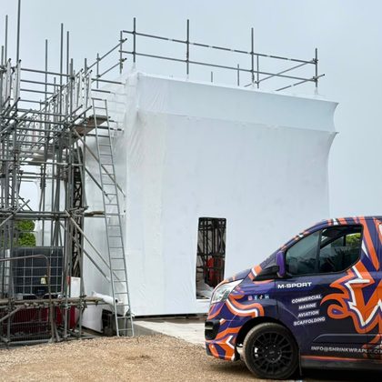 Shrink Wrap UK van beside a wrapped scaffold